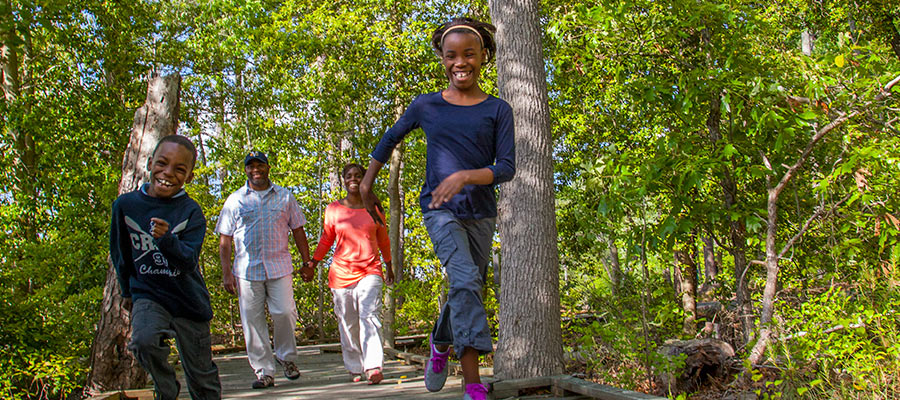 Family hiking at Belle Isle State Park