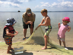 Children using seine net.